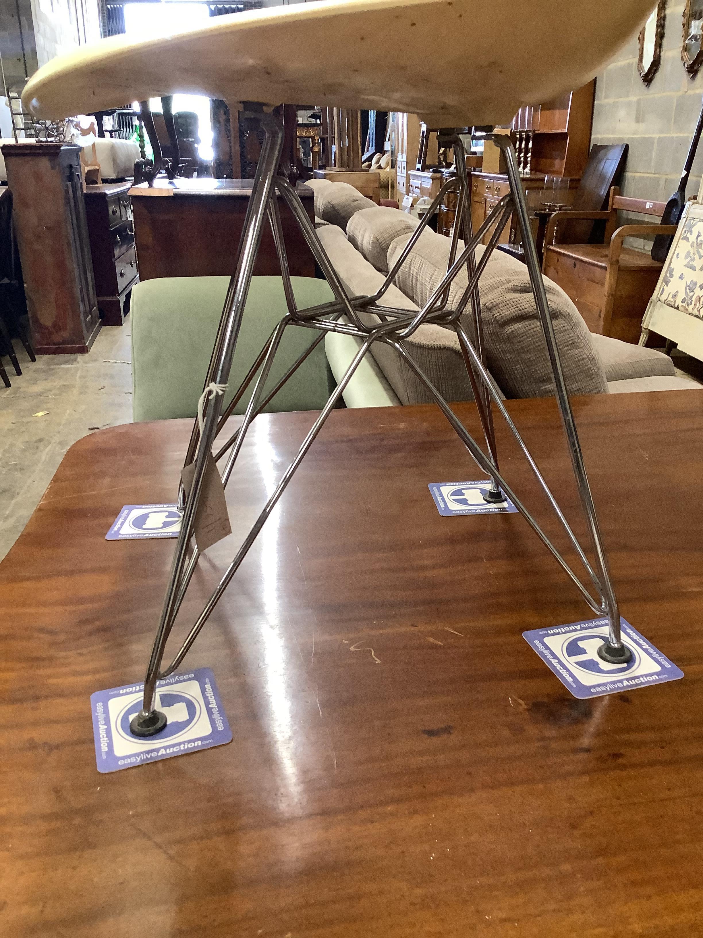 A set of four Eames fibre glass Eifel base chairs